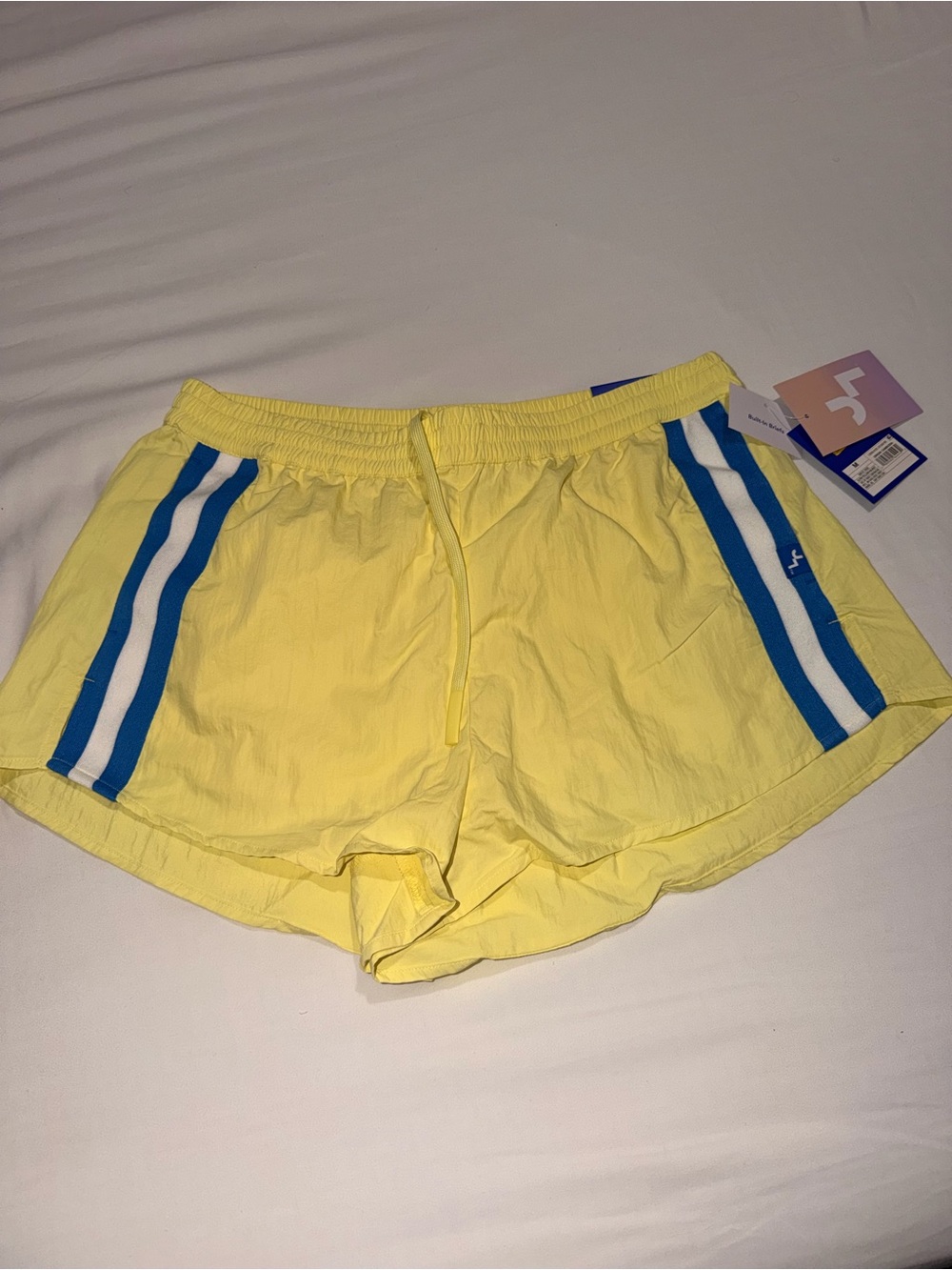JoyLab Yellow Athletic Shorts with Blue and White Side Stripes